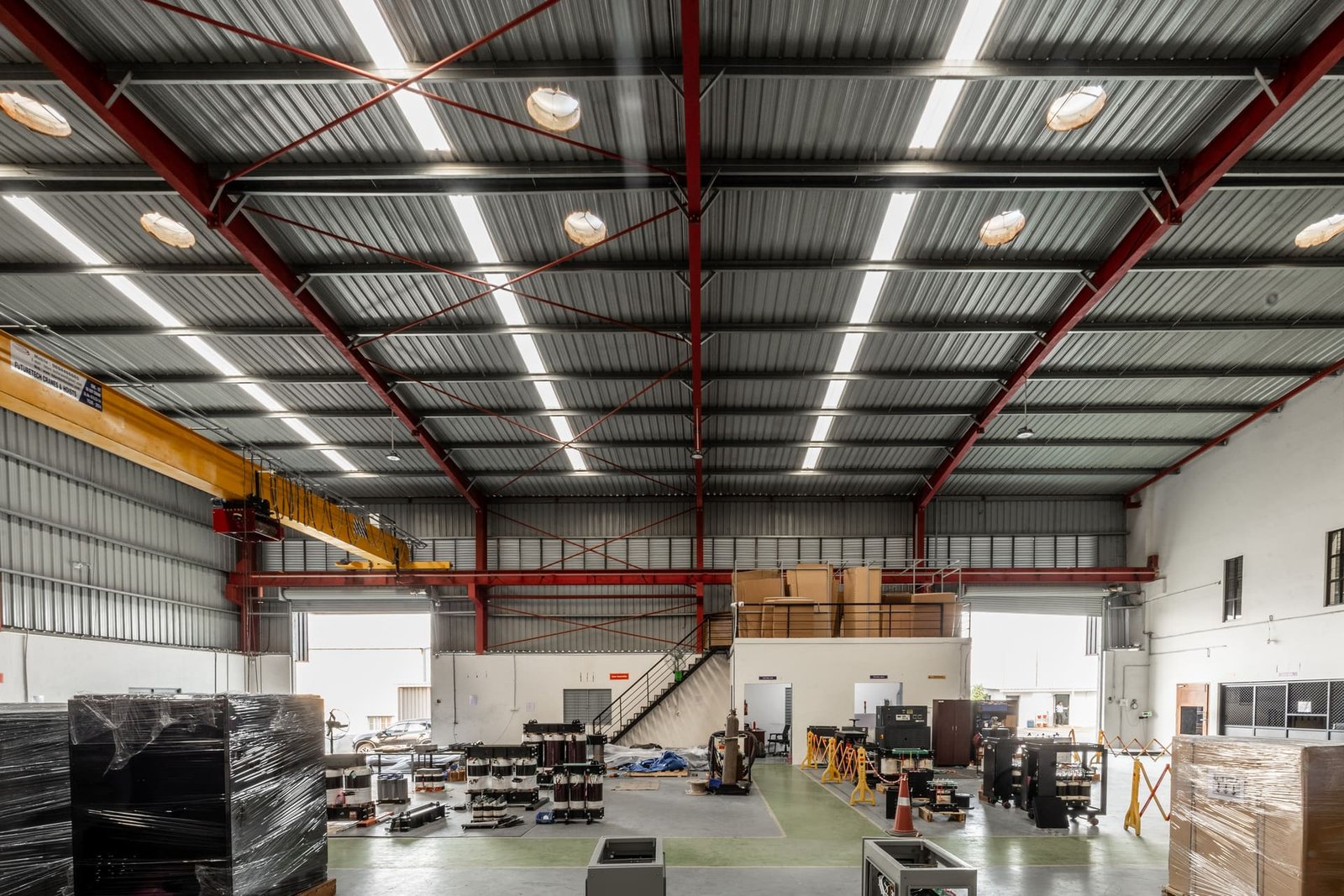 Overview of the manufacturing facility floor with overhead crane and finished units